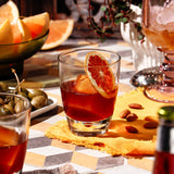 La Passeggiata cocktail with spiced grapefruit syrup, grapefruit bitters, and grapefruit crescents