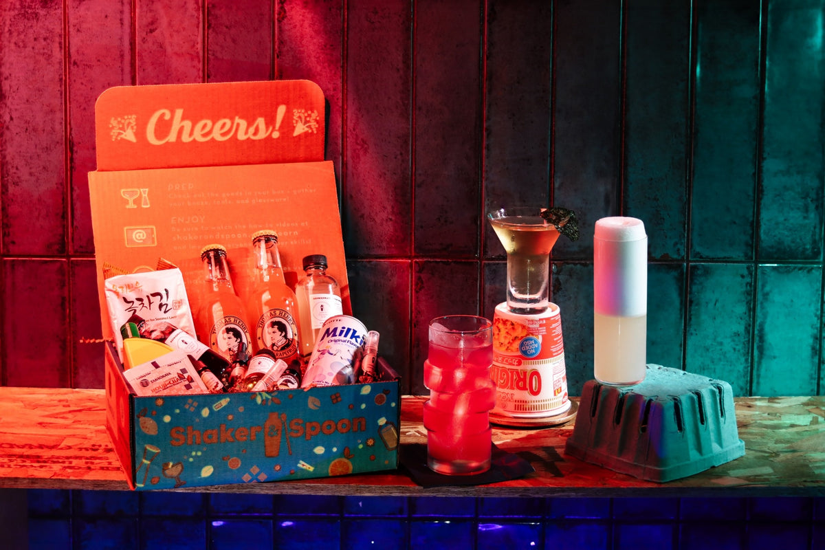 Craft cocktail box with artisan syrups and a finished cocktail